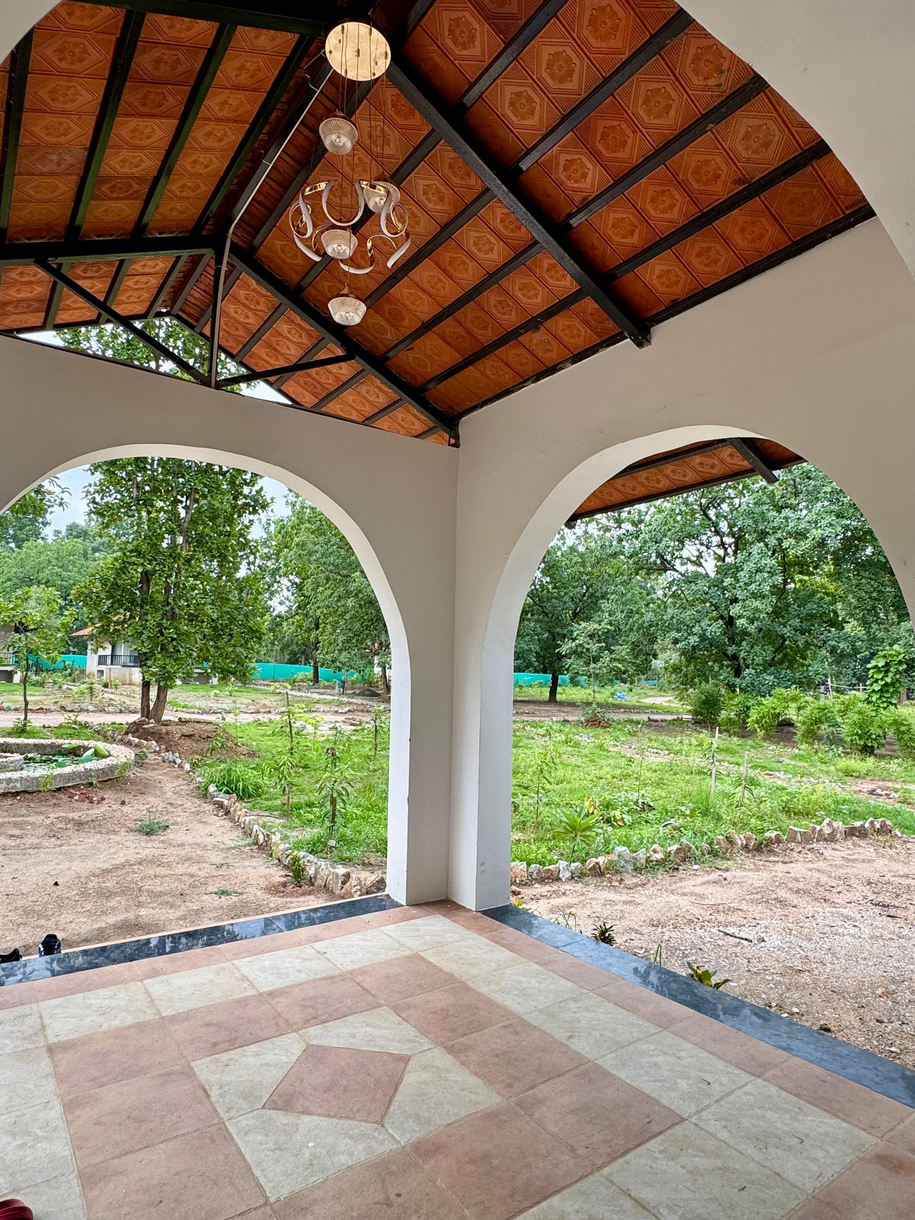 Arched resort veranda opening onto the gardens
