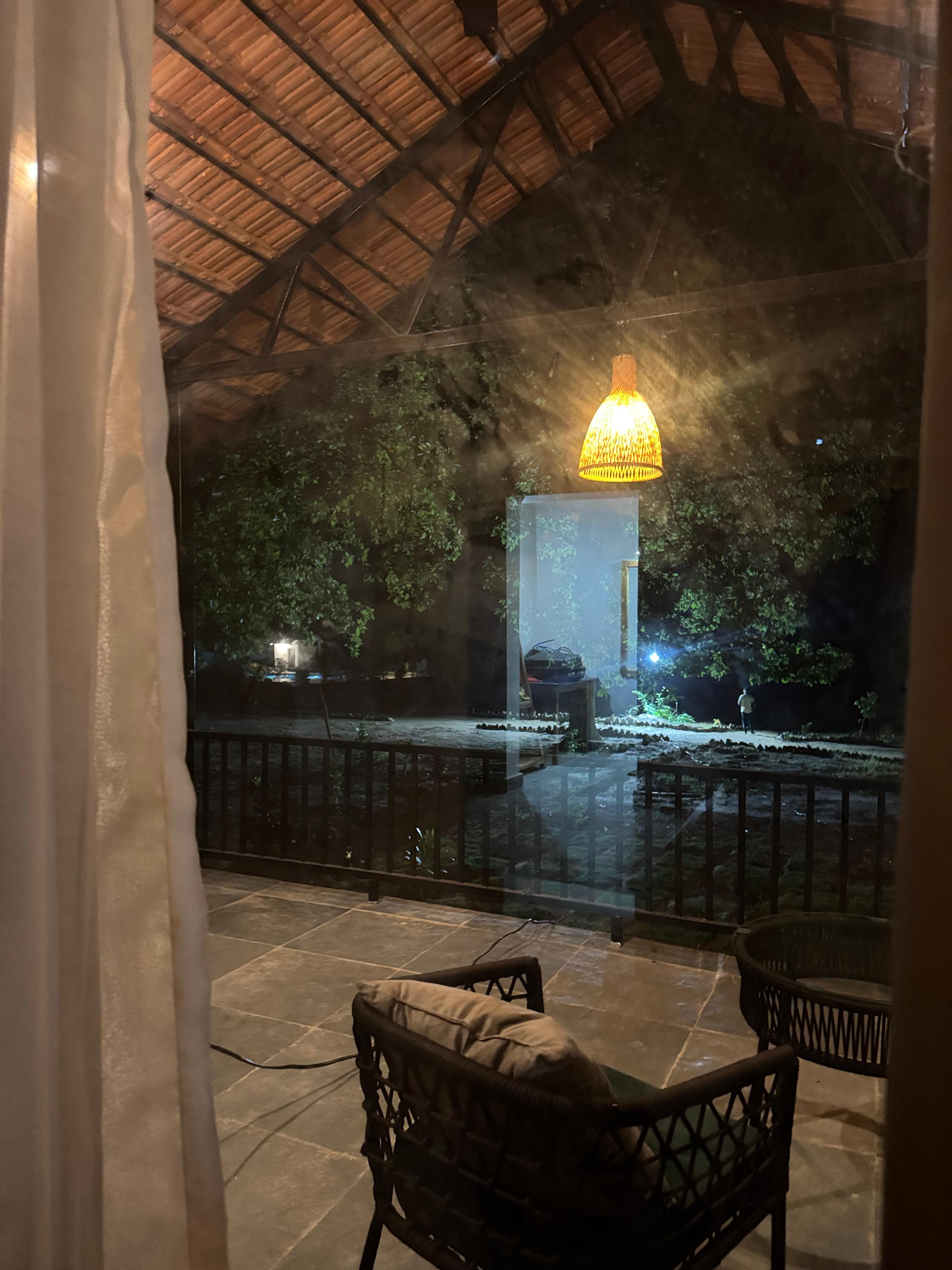 Resort balcony looking into the garden at night
