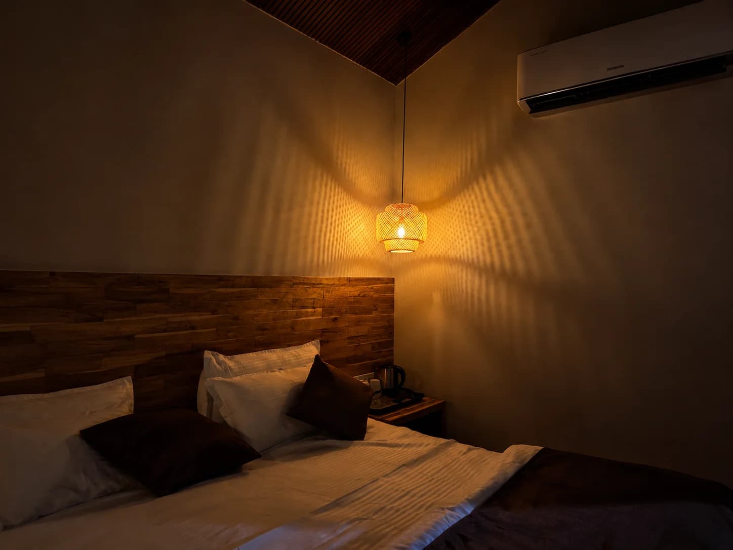 Comfortable room with bedside lamps and wooden bed