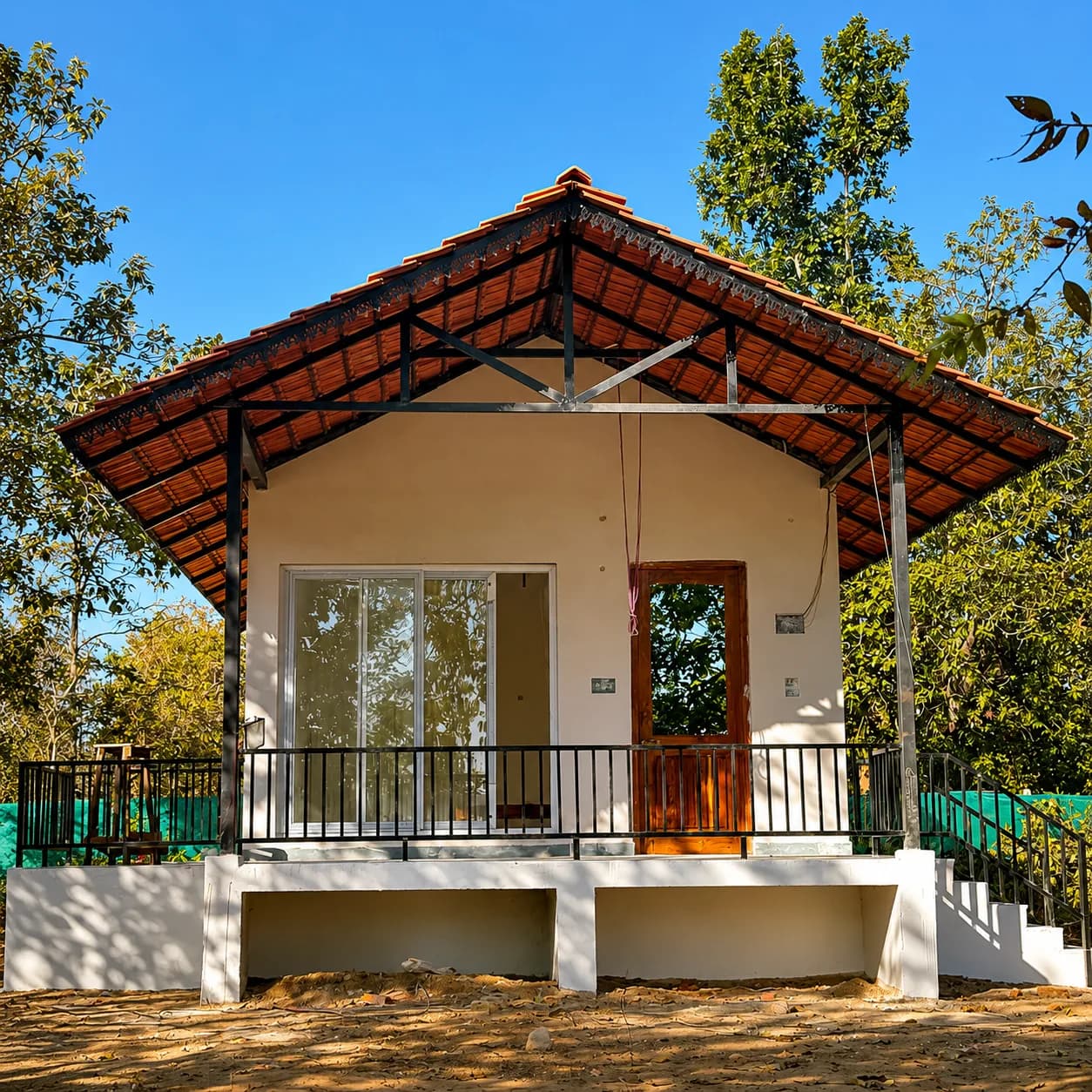 Standalone cottage surrounded by trees
